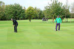 Pop Robson and John Craggs lining up putts on the 5th green